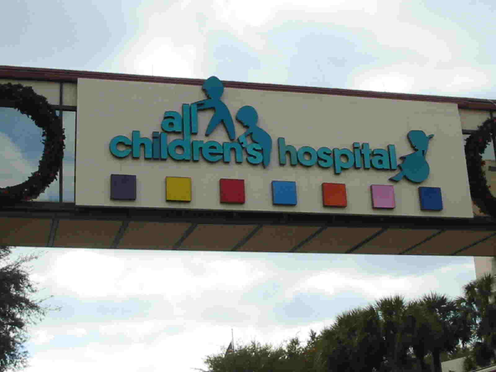 Sign of All Children's Hospital on an overpass above the street